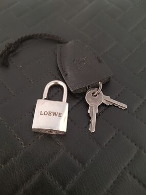 Loewe silvertone lock and two keys w/leather tag EUC